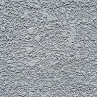 細かな凹凸とざらざらした質感のあらいペンキの白い壁テクスチャーの写真