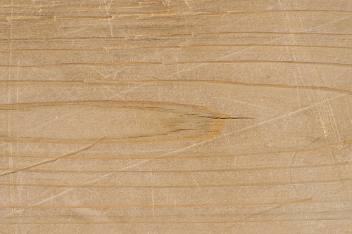 傷と凹みが目立つ木目のテクスチャー