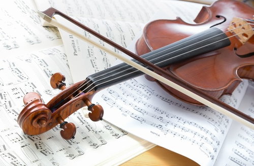 Violin Placed on Sheet Music