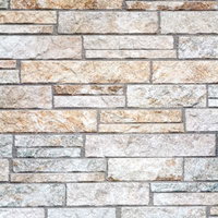 凸凹のごつごつした表面の石タイルの壁のテクスチャの写真