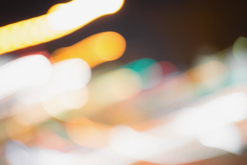 光の軌跡が流れるボケのブレ|夜景イルミネーション背景