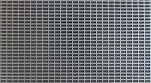 室外機の排気部分のメタルフィルター | グレー金属質テクスチャ