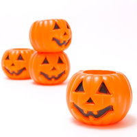 積み重ねたハロウィン用のかぼちゃ容器の写真