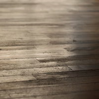 光が差し込む木目のフローリングの写真