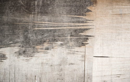 右側がベージュで左側が暗いグレーの木材板の壁テクスチャー