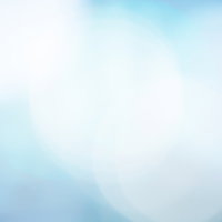 淡い色の光が柔らかく広がる青く冷たいボケの背景写真の写真