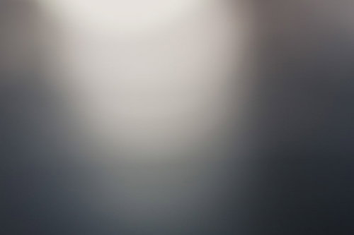 奥の方でぼけたライトと光の背景｜グラデーション