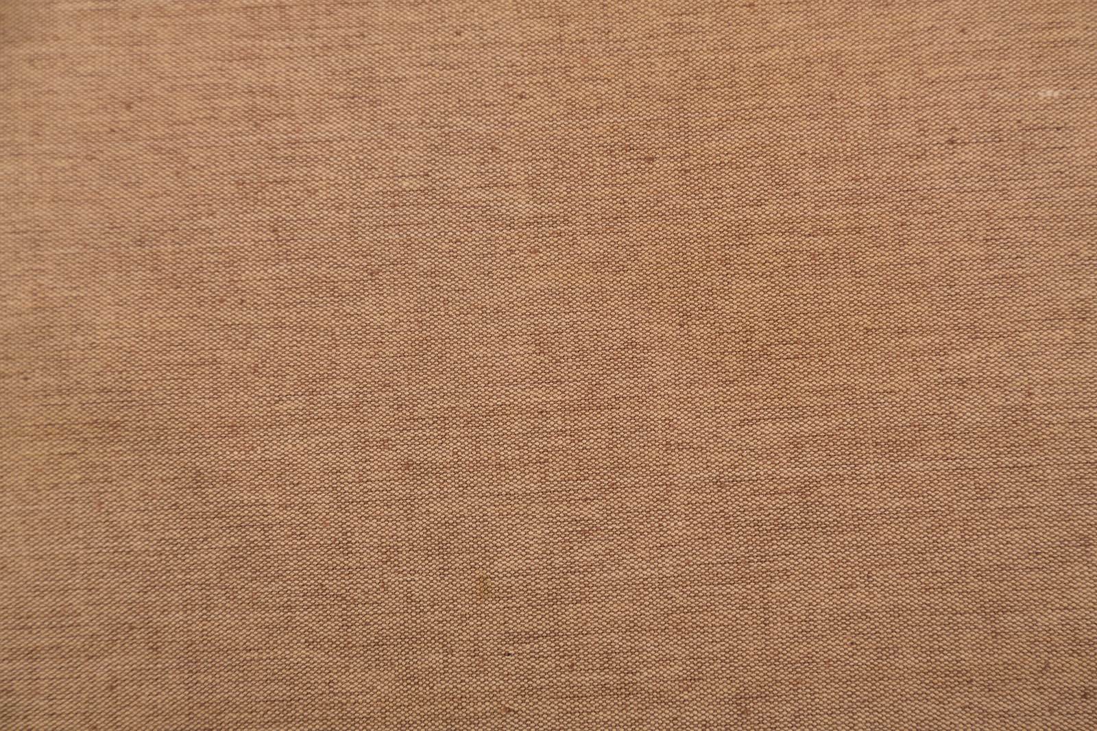 茶色の布生地のテクスチャが写った写真