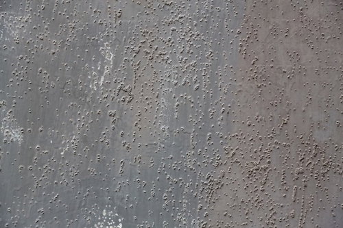 ぶつぶつした錆びた壁のテクスチャ