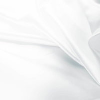 流れるように重なり合う白い布や紙のシルク風テクスチャーの写真