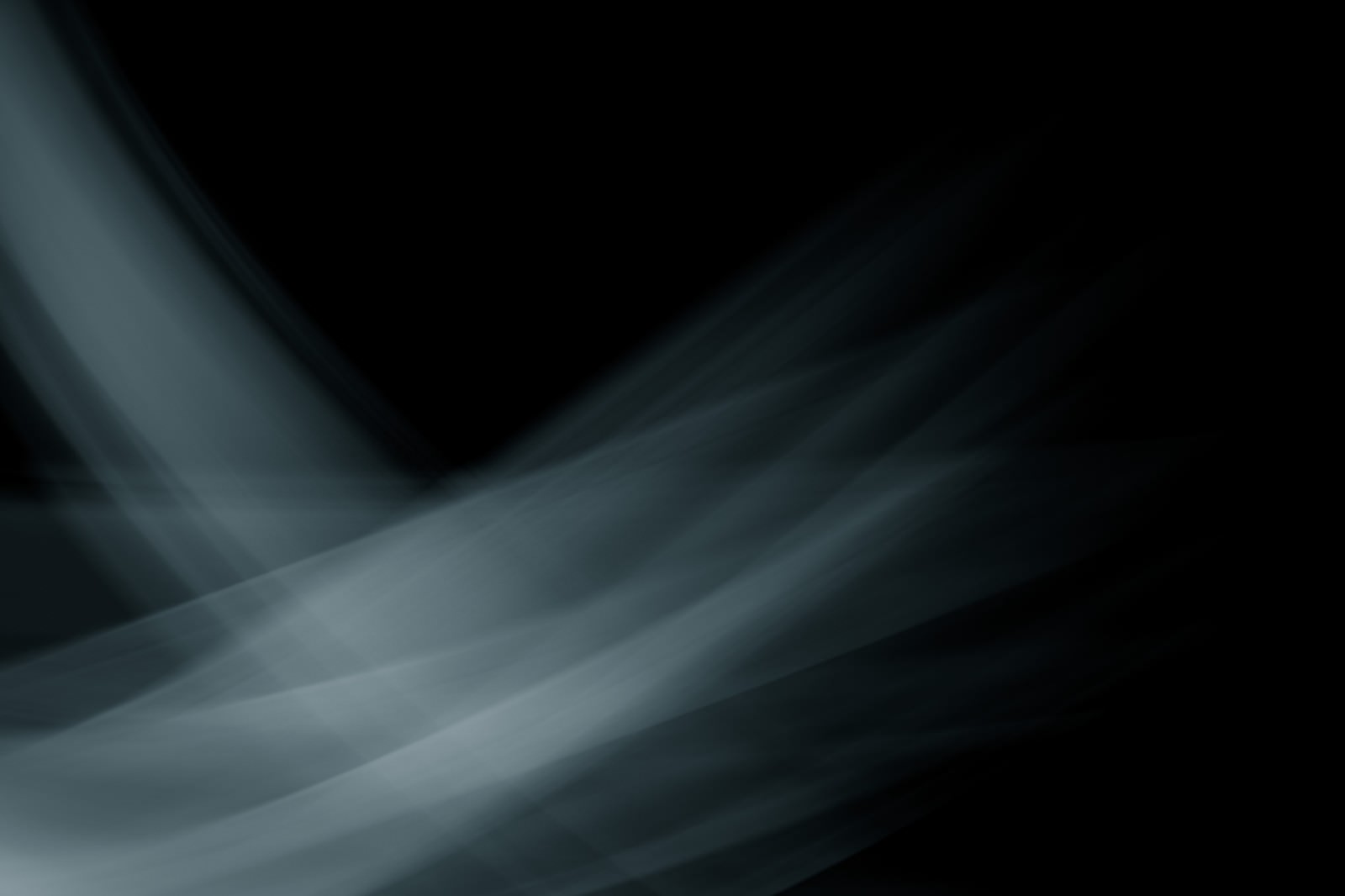 黒い背景に曲線を描いて流れる白い光の跡が重なる抽象的な画像