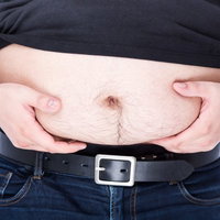 お腹の脂肪がなかなか落ちない男性の体脂肪測定の写真