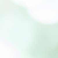 波打つ素材のぼかしを活かした柔らかい淡い緑の光の抽象写真の写真