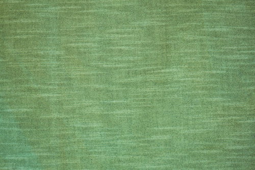 横方向の木目が走る緑色のウグイス色の板のテクスチャー