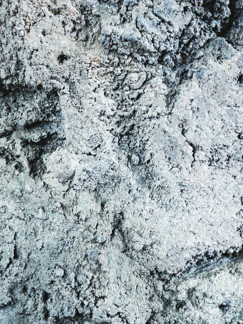 グレーのコンクリート凸凹テクスチャー 建築素材用壁面