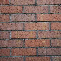 表面に傷が入った煉瓦の壁のテクスチャーの写真