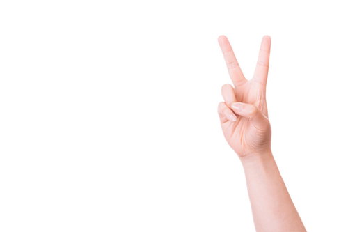 ピースサインをする女性の手（イエーイ）白背景