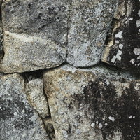 風化した大きな石垣の表面 古い建築の石材テクスチャーの写真