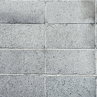 グレーのコンクリートブロックの壁テクスチャーの写真