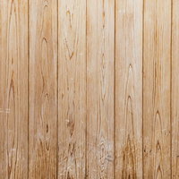 傷の残る木目調の壁板のテクスチャーの写真