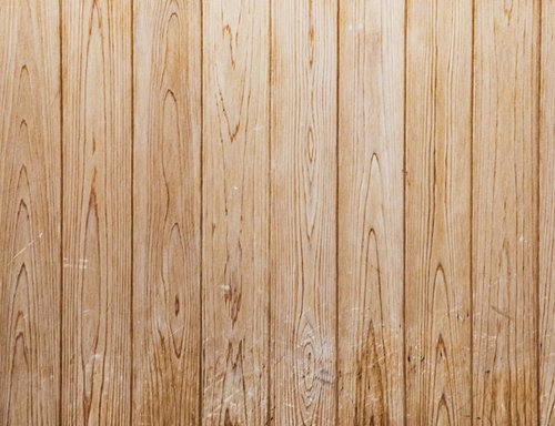 傷の残る木目調の壁板のテクスチャー