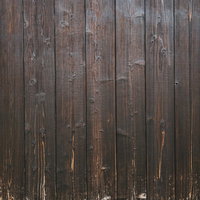 擦り傷や汚れが残る古材の木目板のテクスチャーの写真