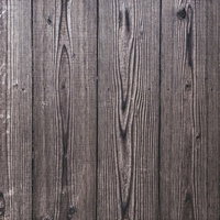 グレーがかった古材の木目が見える板壁テクスチャーの写真