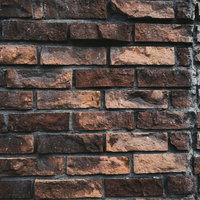 経年変化を感じさせる味わいのあるレンガ壁のテクスチャーの写真