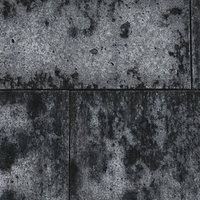 シミのようにこびりついたコンクリートの壁の写真
