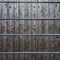 グレーがかった木目の板壁テクスチャーの写真