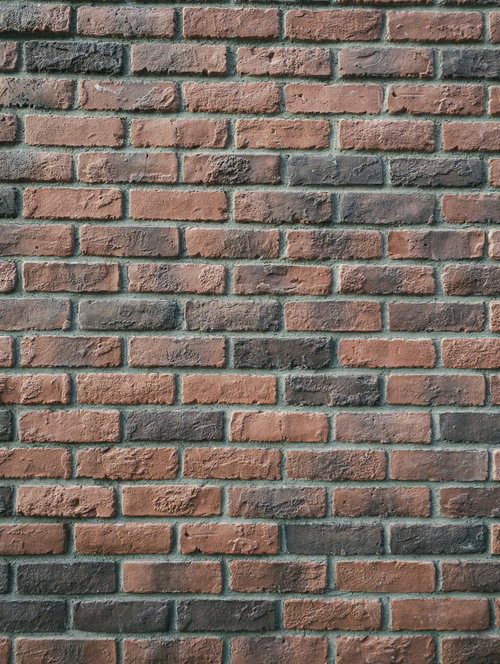敷き詰められたレンガ壁のテクスチャーと色合い