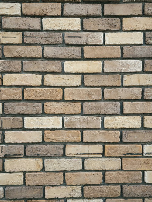 黄土色のレンガ壁のテクスチャー