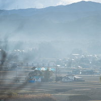 天神岬公園から撮影した楢葉町方面の町並みと山々の写真
