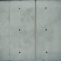 コンクリート打ちっぱなしの壁のセパ穴テクスチャの写真