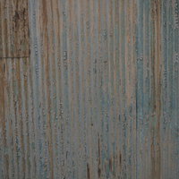 金属の波板に付着する汚れと錆のテクスチャーの写真