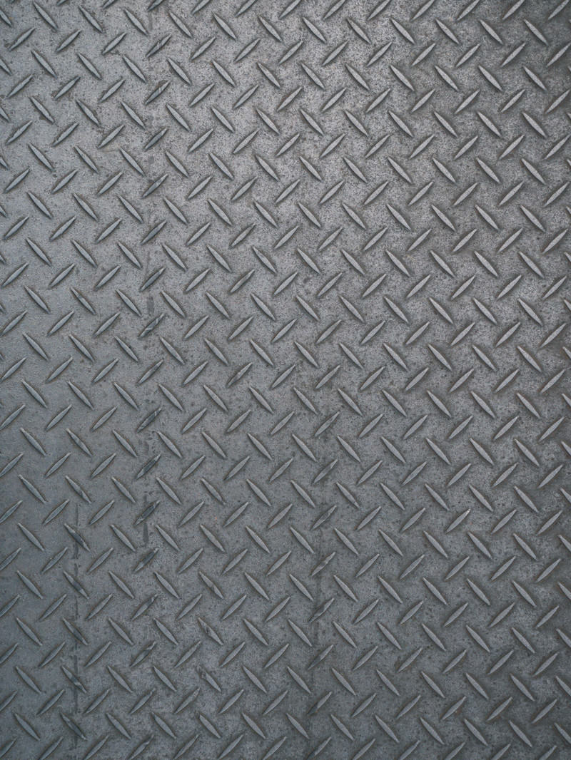 グレーの縞鋼板にダイヤモンド模様の滑り止め加工が施されたテクスチャ