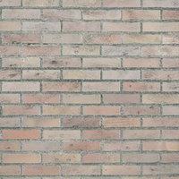 薄汚れた経年劣化したレンガ調外壁のテクスチャの写真