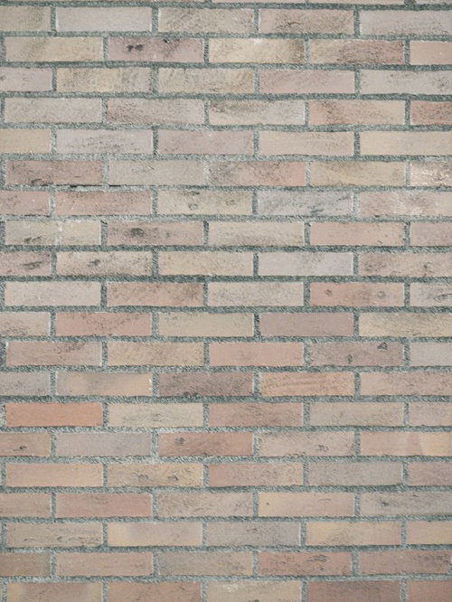 薄汚れた経年劣化したレンガ調外壁のテクスチャ