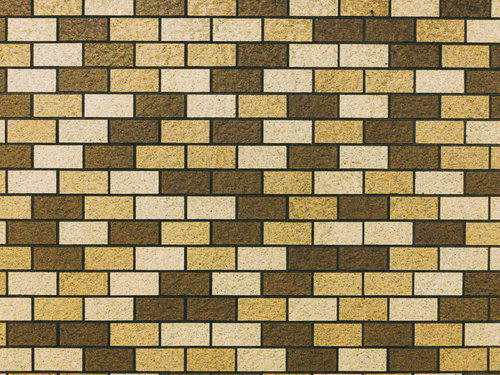 不規則に張られたレンガ調タイル壁（ベージュ・茶色系テクスチャ）