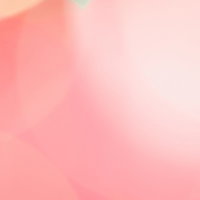 桃色の玉ボケとグラデーション背景の写真