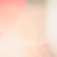 暖色系のネオンが光のボケで広がる抽象背景の写真