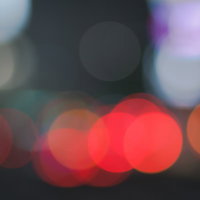 玉ボケの背景素材（赤・オレンジ）夜の光の写真