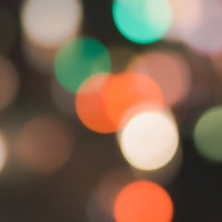 オレンジとグリーンのキラキラ玉ボケの写真