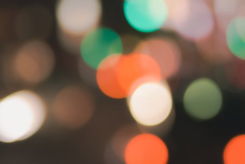 オレンジとグリーンのキラキラ玉ボケ