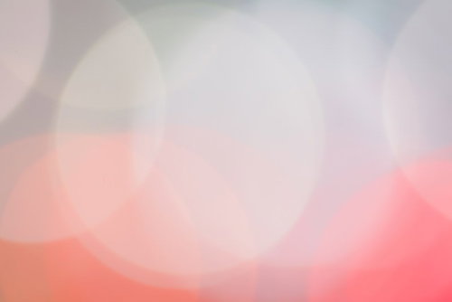 暖色系の光が重なる大きな玉ボケ背景