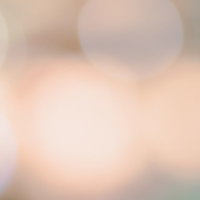 暖色系の光が重なる霞むボケ味の背景の写真