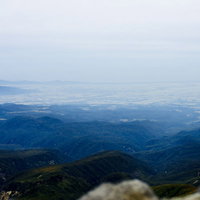 日本百名山・月山の山頂から眺める庄内地方の遠景の写真