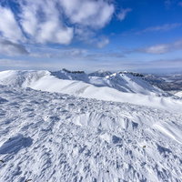 冬の安達太良山外輪の雪景色と青空の写真