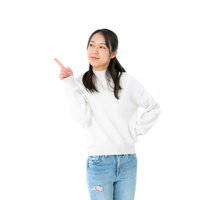 左上を指差す若い女性のポーズ、笑顔でジェスチャーの写真