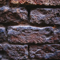 建造物に使われている赤茶色のレンガ壁のテクスチャの写真